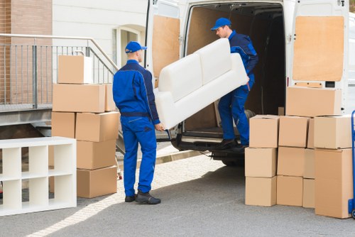 Mover carrying household items during a Haringey relocation