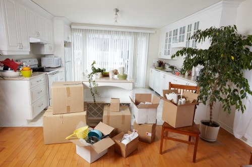 Organised storage unit with stacked boxes and furniture in Haringey