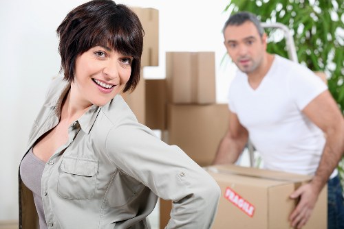 Team carefully loading furniture during a house move